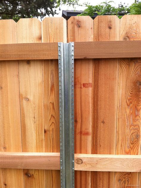 brackets for attach a wood panel to a metal posts|2x4 to 4x4 bracket.